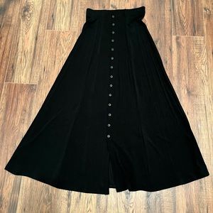 WOMENS Black polyester/spandex stretch long skirt. Length 35” inches